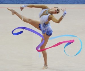 First place winner Evgenia Kanaeva of Russia performs with the ribbon during the seniors individual final competition at the 27th Rhythmic Gymnastics European Championships in Minsk on May 29, 2011. AFP PHOTO / VIKTOR DRACHEV (Photo credit should read VIKTOR DRACHEV/AFP/Getty Images)